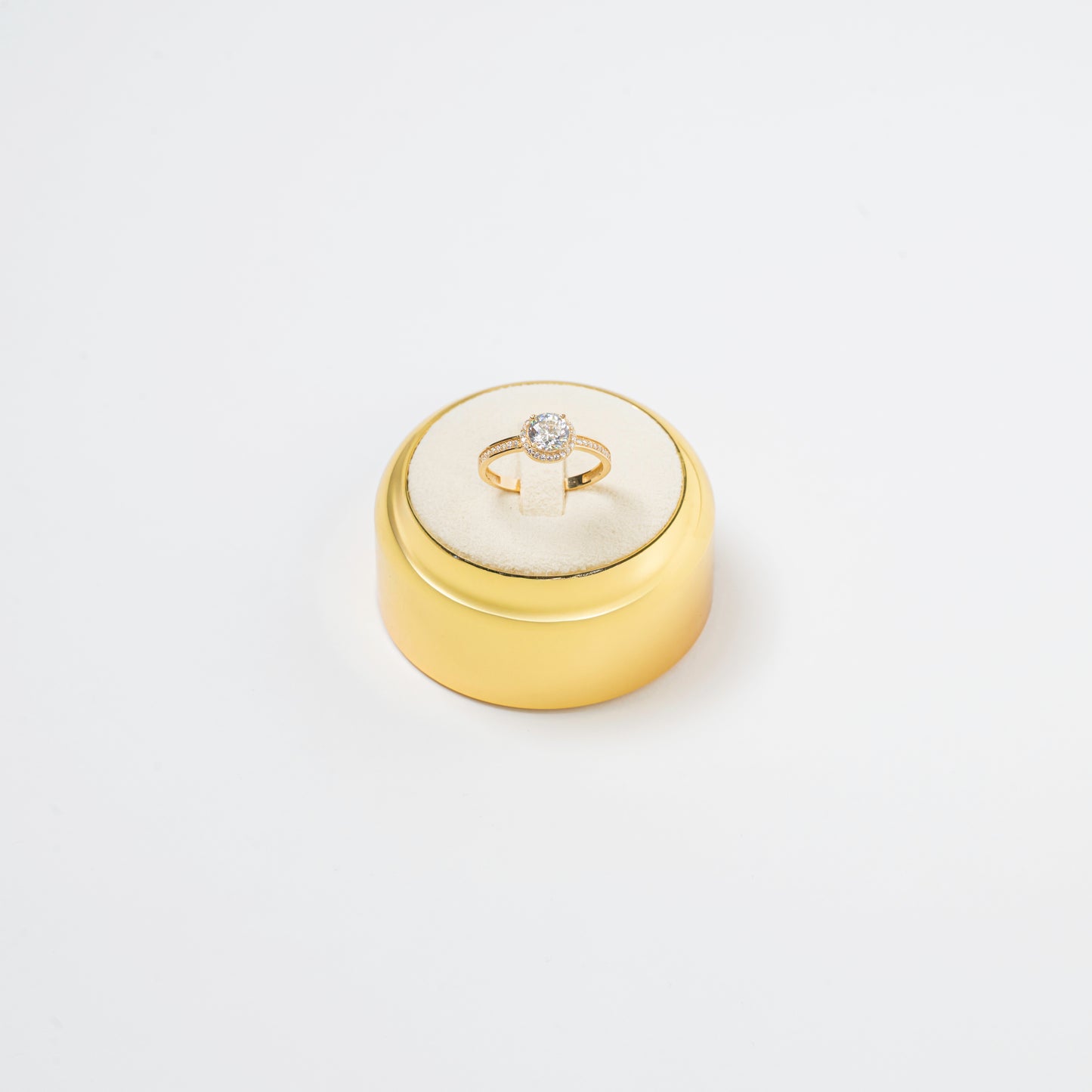 Ring with a smaller diamond in the center 18 K Gold
