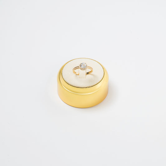 Ring with a smaller diamond in the center 18 K Gold